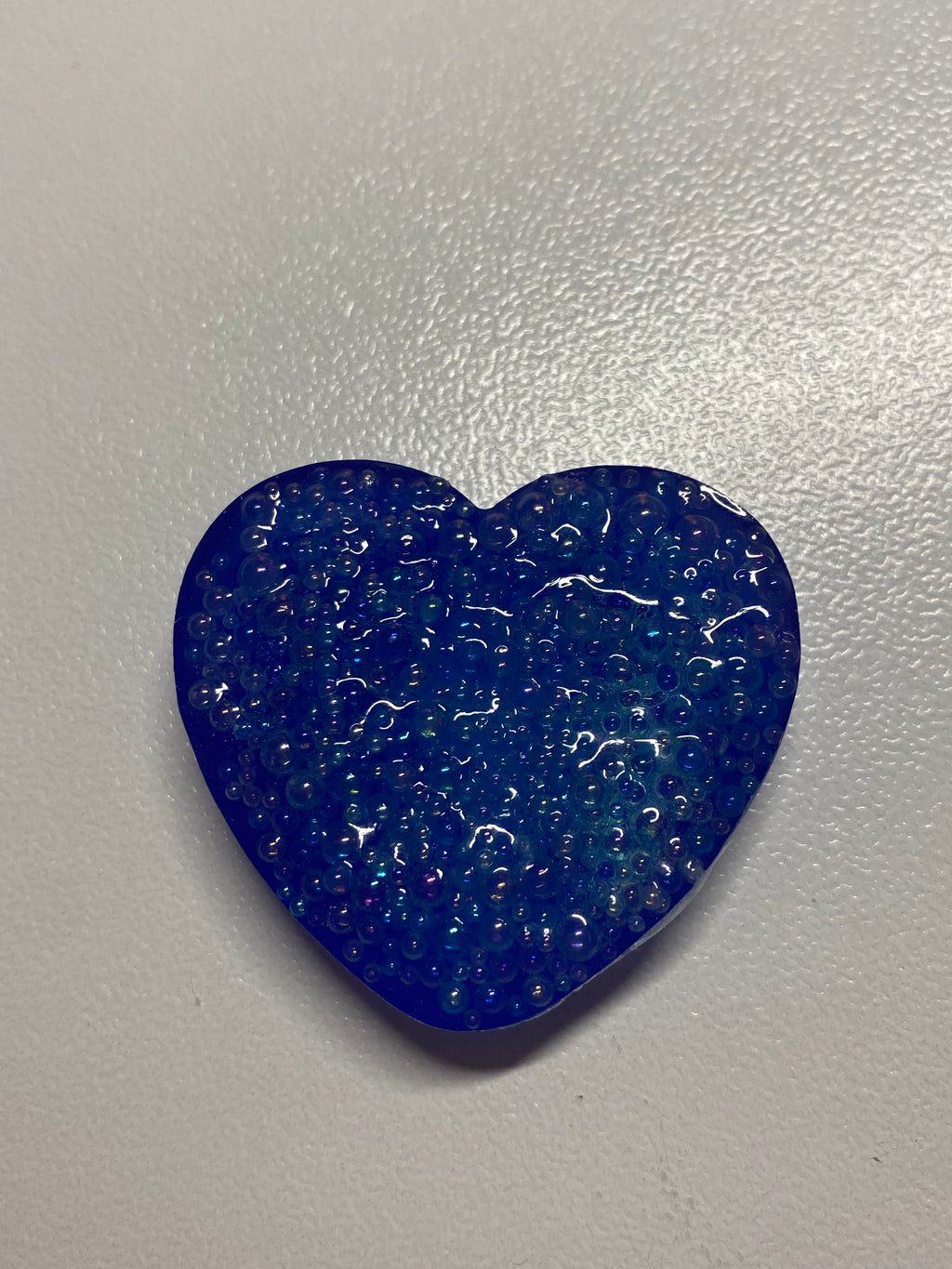 Galet sensoriel fait main bleu avec bulle