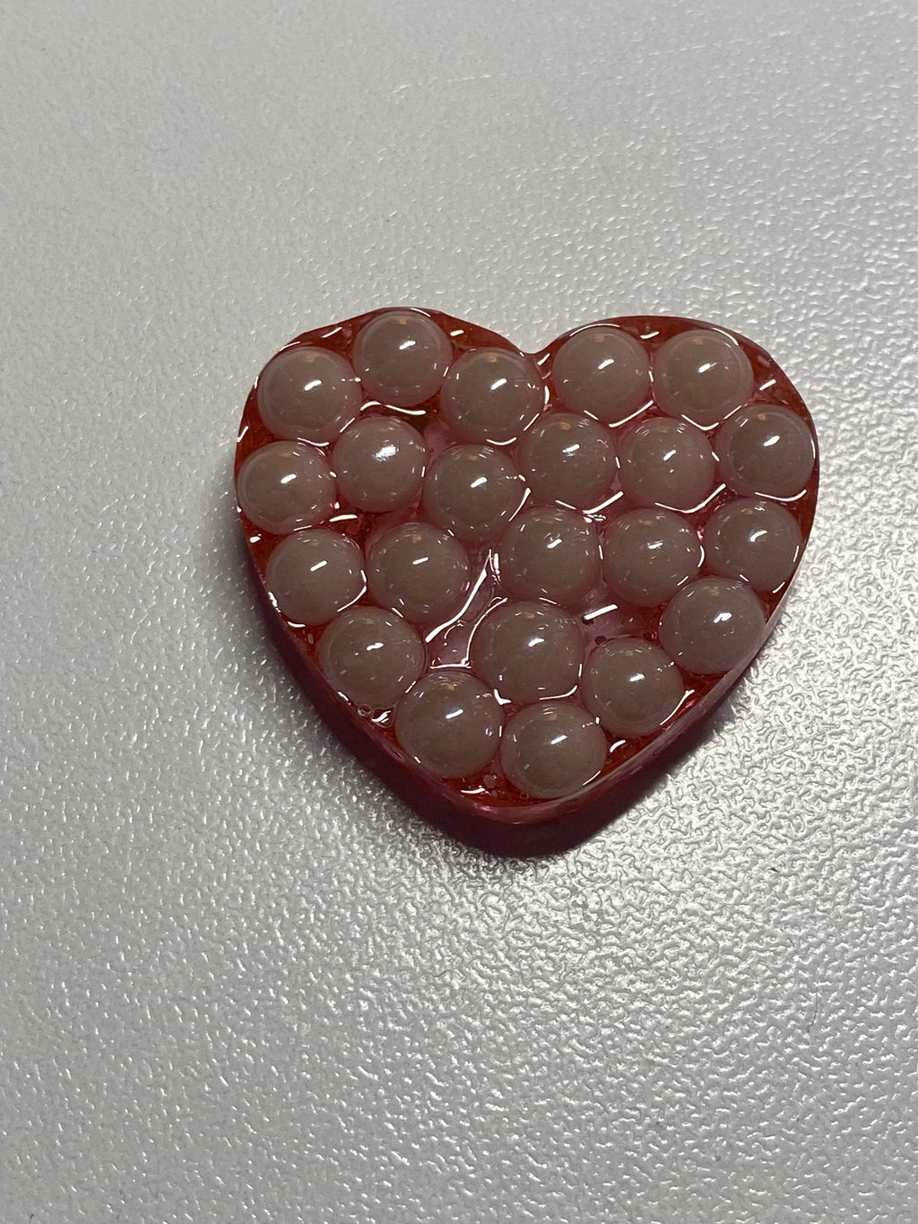 Galet sensoriel fait main paillettes rose avec perles plates