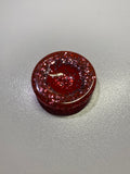 Galet sensoriel fait main paillettes rouge et bille plate