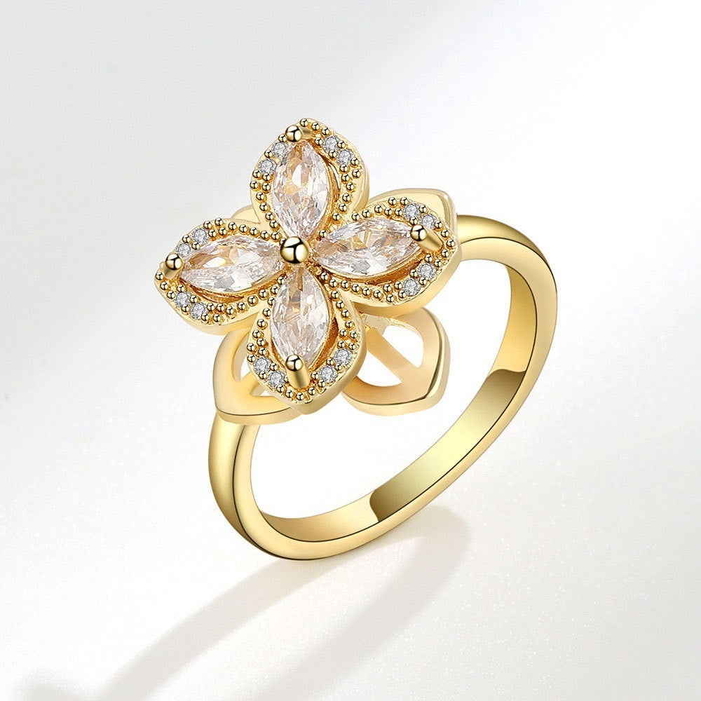 Bague fleur strass blanc dorée anti-stress ajustable