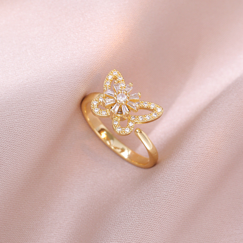 Bague papillon et fleur blanche dorée anti-stress ajustable