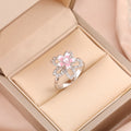 Bague fleur strass intérieurs fleur rose et blanche argentée pivotante anti-stress ajustable