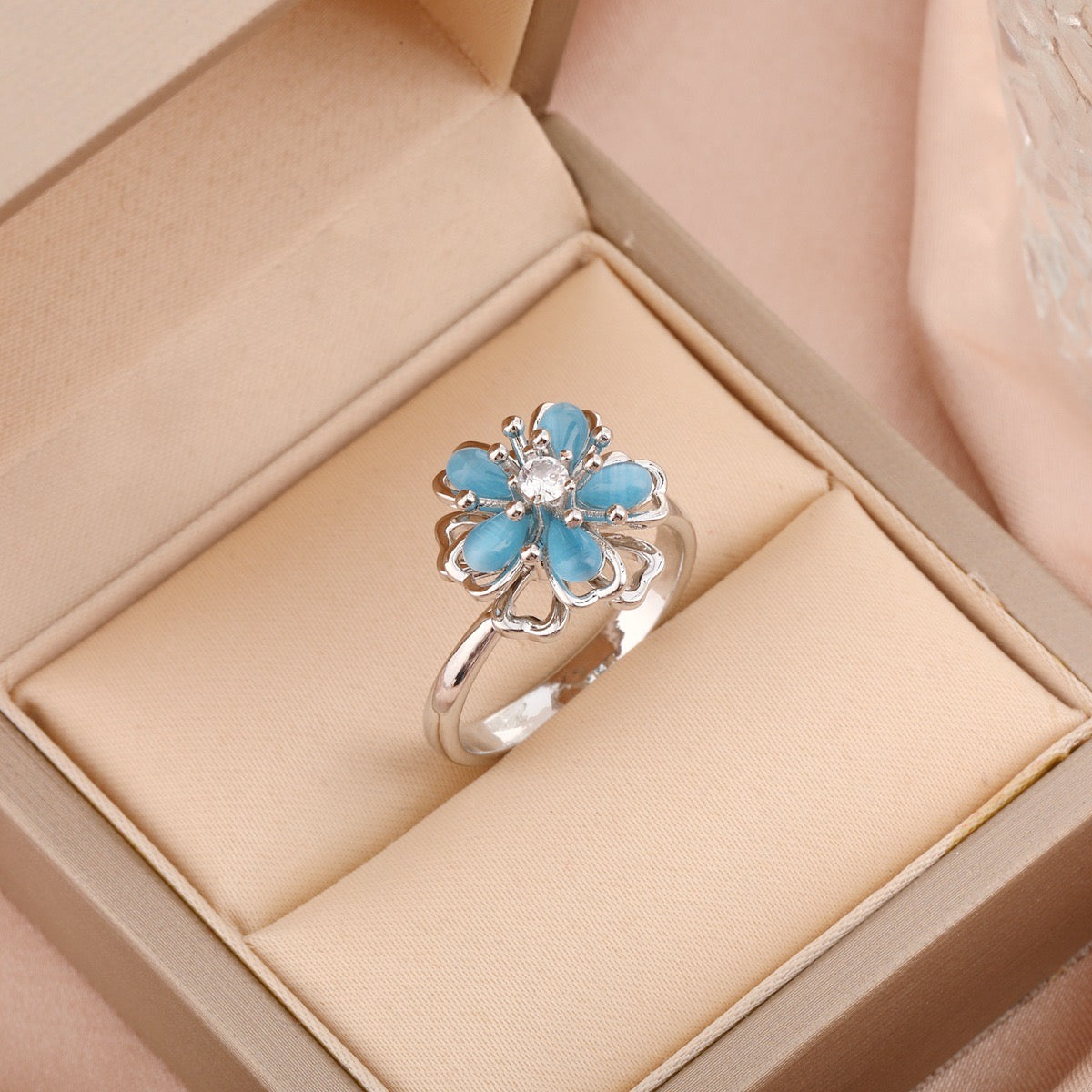 Bague fleur bleu pivotant argentée anti-stress ajustable