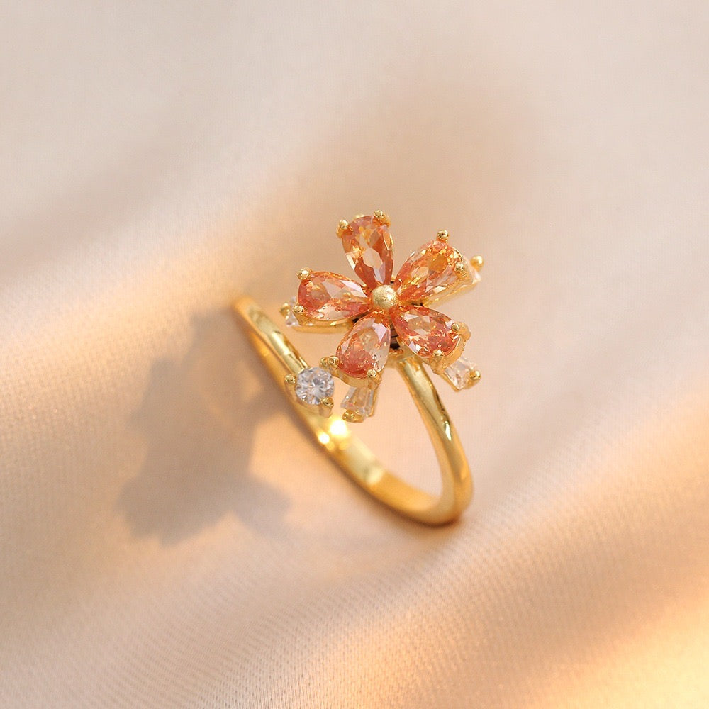 Bague fleur orange pivotant dorée anti-stress ajustable